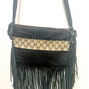 Vintage leather fringe crossbody bag with Gucci material .